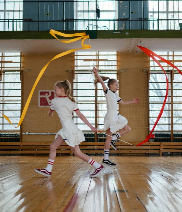 Active woman performing rhythmic cardio exercises in a bright studio environment.